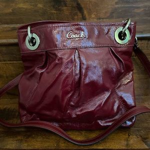Coach patent burgundy/deep red crossbody bag.